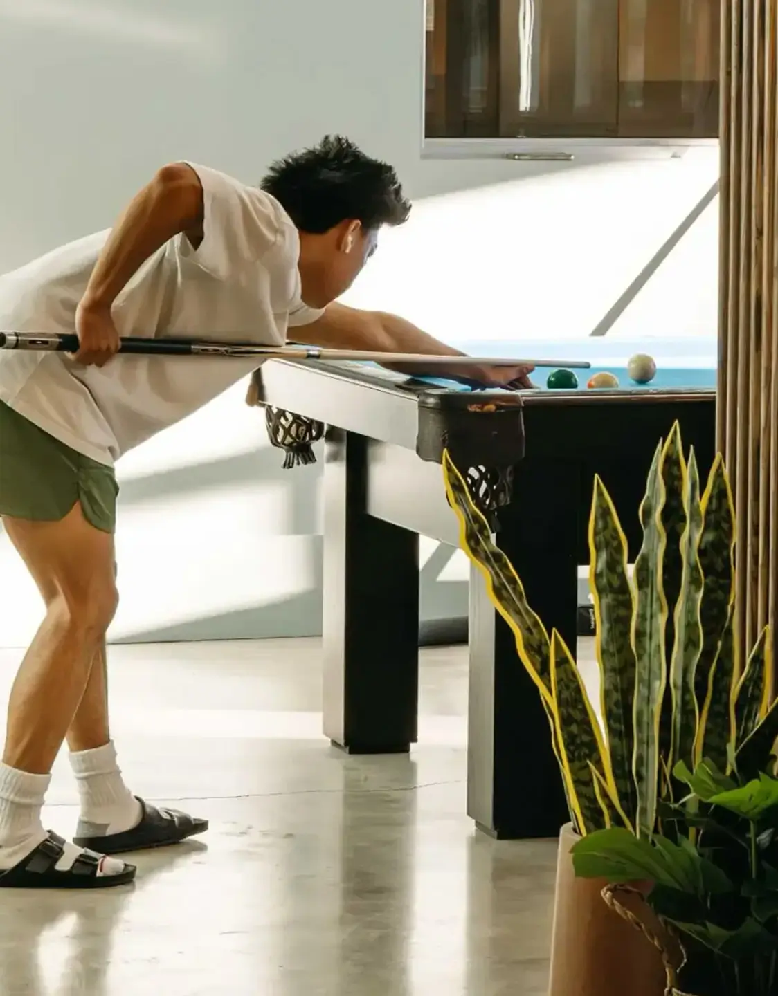 young man playing pool