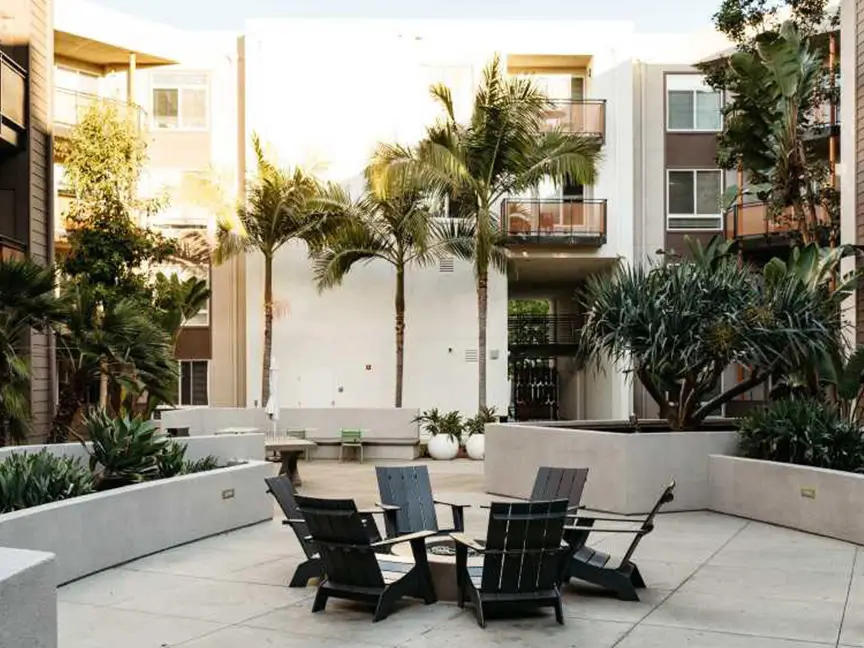 lounge chairs surrounding a fire pit