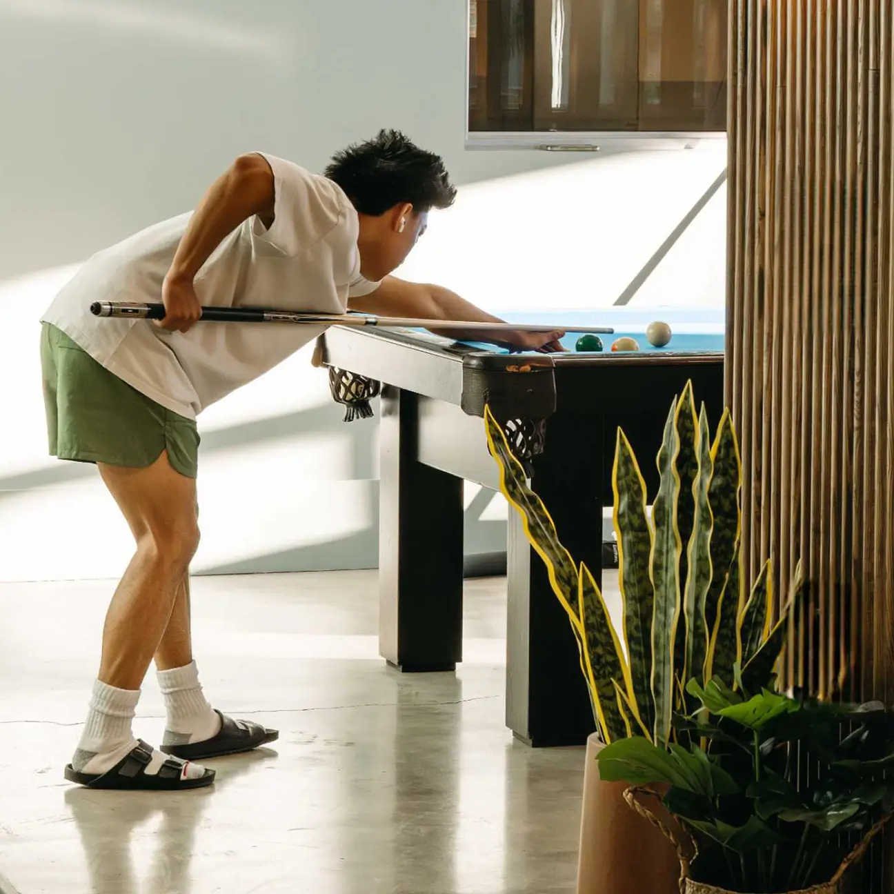 young man playing pool